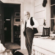 Nora Heysen with her dog standing outside her home, Hunters Hill, Sydney