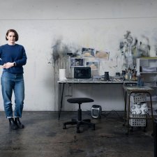 Fiona McMonagle standing in her studio with paint splatters on the white walls Fiona McMonagle standing in her studio with paint splatters on the white walls