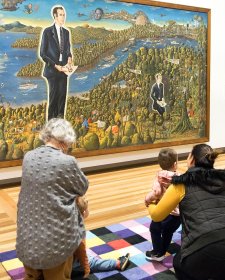 Children and parent in front of the portrait Dr Brown and Green Old Time Waltz