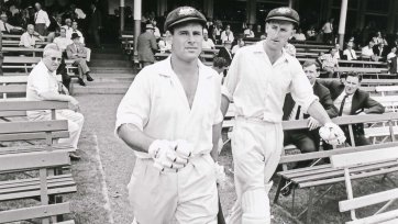 Norman O'Neill and Bill Lawry coming out to bat for Australia vs South Africa at the Sydney Cricket Ground Norman O'Neill and Bill Lawry coming out to bat for Australia vs South Africa at the Sydney Cricket Ground