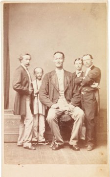 Chang the Chinese giant in European dress with Chinese boy and three European men, one of whom is his manager Chang the Chinese giant in European dress with Chinese boy and three European men, one of whom is his manager