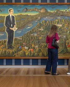 Visitors in the Power suits: The fit within the frame exhibition, May 2026, featuring Harold Thornton's Dr Brown and green Old Time Waltz 1983